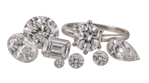 Loose white diamonds of different sizes and a solitaire ring