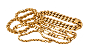 Several gold chains in different link styles: rope, cuban, figaro and box, loosely piled