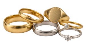 A group of six yellow and white gold rings, including plain bands, a signet ring and small diamond rings